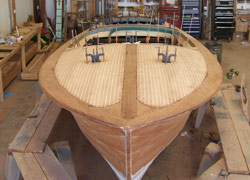 Hand made deck ply being installed on the fore deck